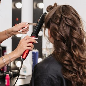 female-hairdresser-makes-bride-hairstyle-scaled.jpg