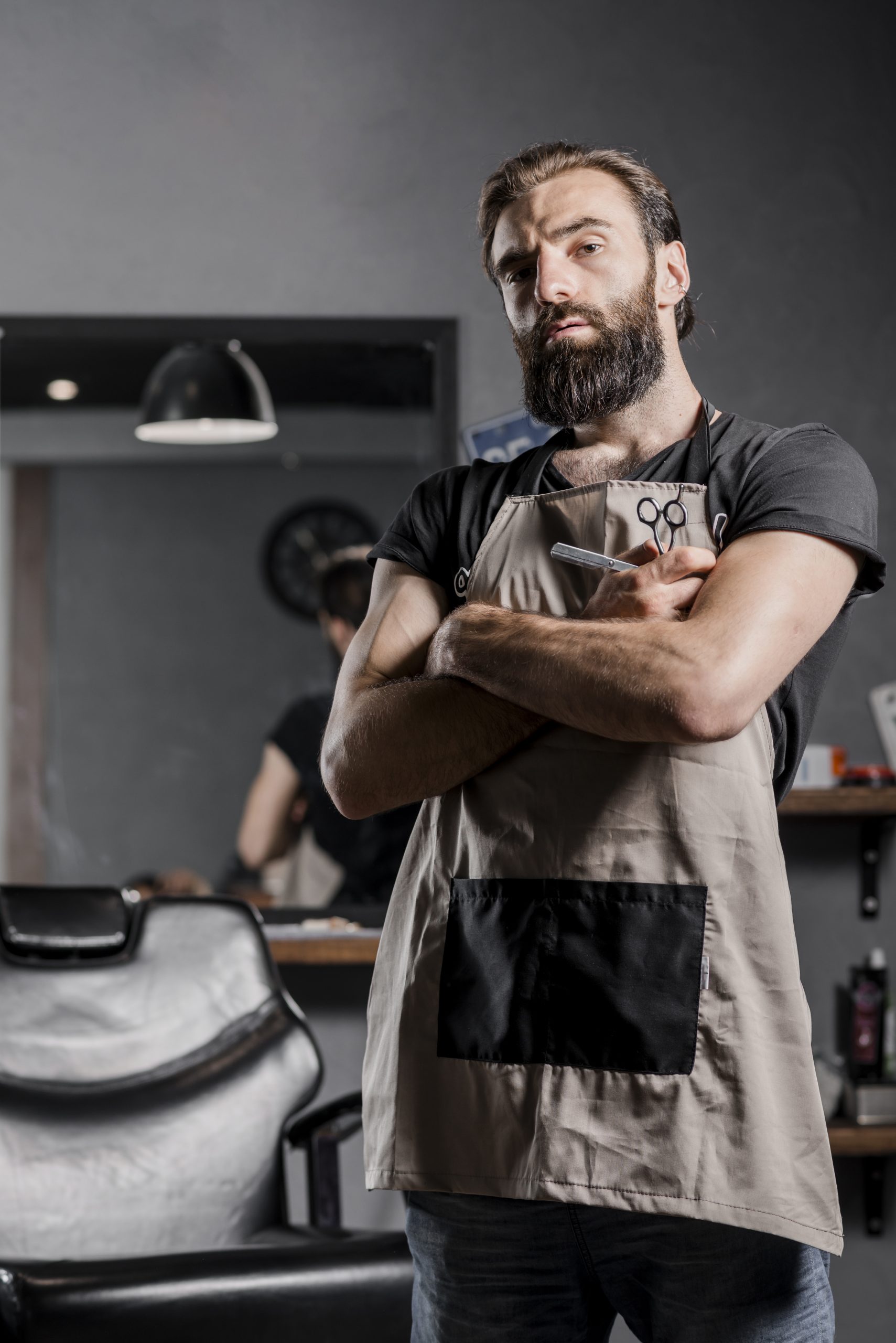 portrait-mid-adult-bearded-male-barber-with-folded-arms